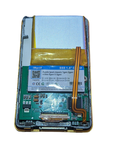 2000mAh half battery fitted next to an mSATA SSD mod in an iPod Classic